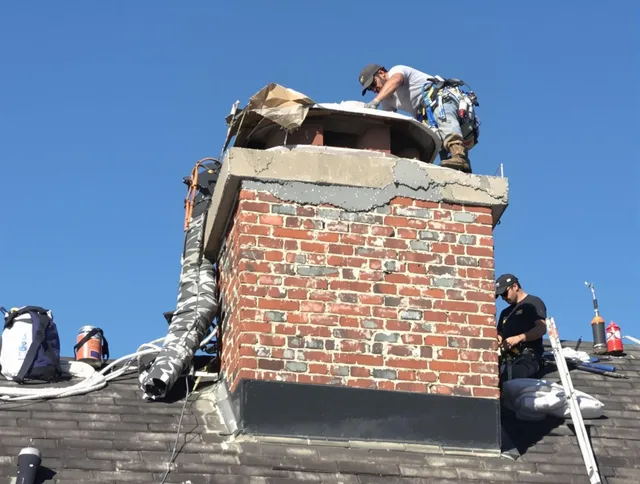 Gahanna Chimney Sweep installing a custom chimney crown in Gahanna, OH