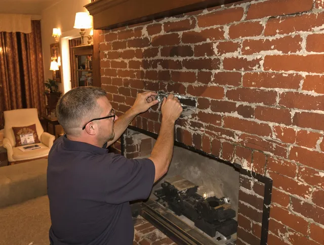 Gahanna Chimney Sweep expert fixing a fireplace in Gahanna, OH